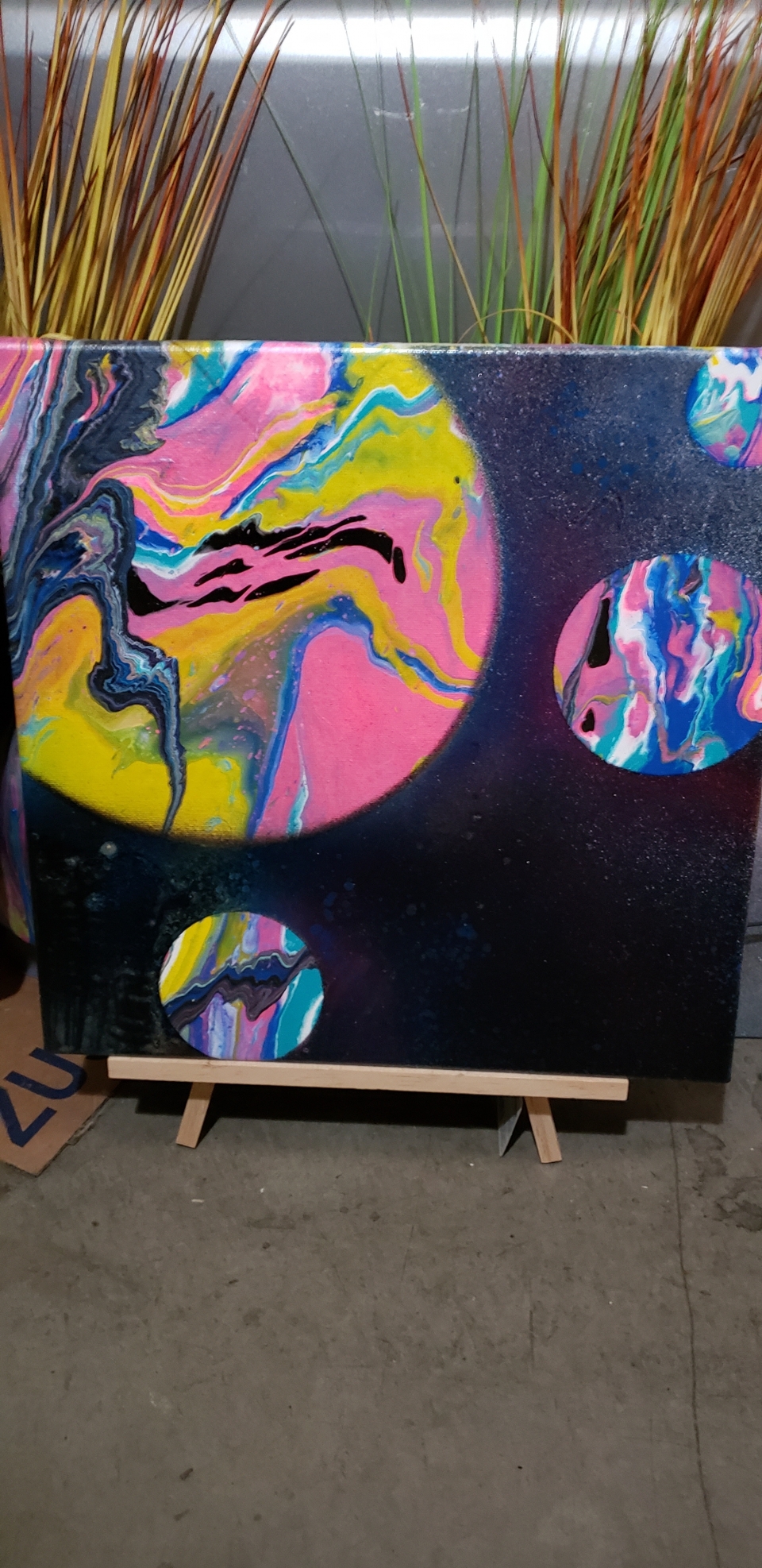 Paint pouring with spray paint over